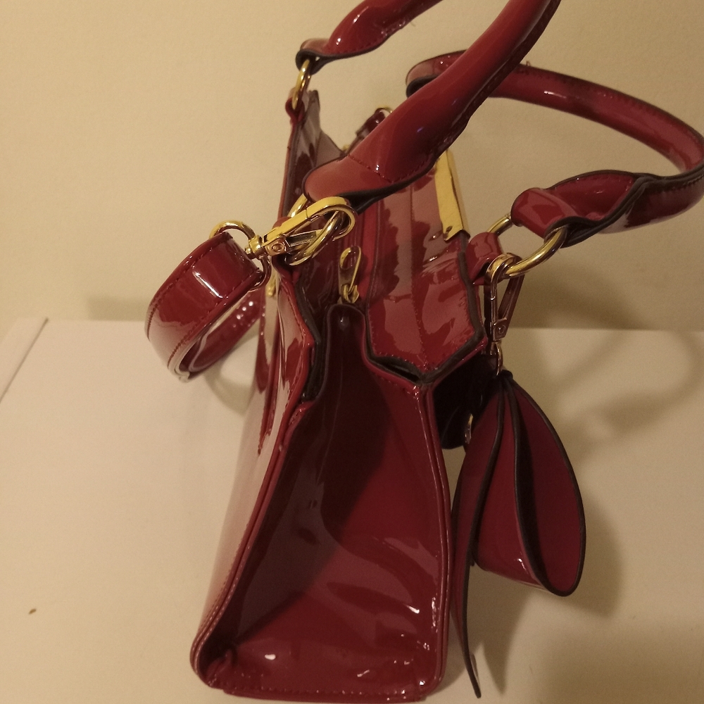 Red patin leather crossbows bag. Still in good condition. - Picture 2 of 5